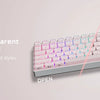 A close-up view of a light pink translucent mechanical keyboard with clear and transparent aura design.