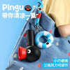 A black and red penguin-shaped handheld fan is shown inside a blue fabric bag.