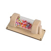 A wooden rain sound tube musical instrument filled with colorful plastic beads.