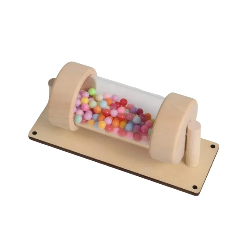 A wooden rain sound tube musical instrument filled with colorful plastic beads.