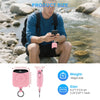 A pink portable power bank is shown being used by a man outdoors near a stream, with dimensions provided.