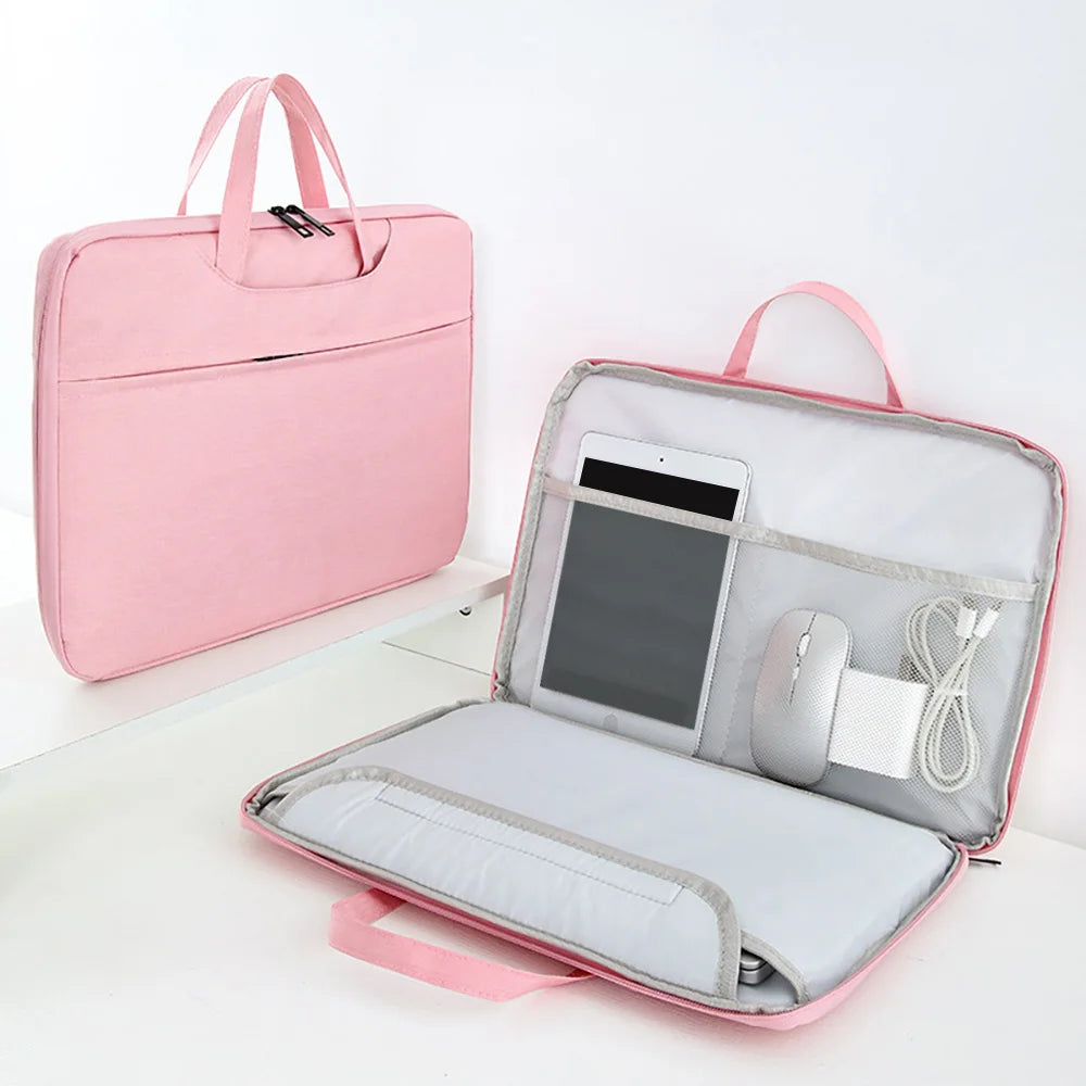 A pink universal laptop sleeve designed to protect a MacBook or PC, shown open with accessories.