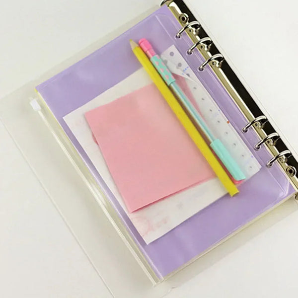 A set of ten zippered PVC binder pockets for A5 to A7 notebooks, featuring pink and yellow pens.