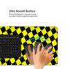 A hand is shown interacting with a black and white checkered desk mat for gaming and work.