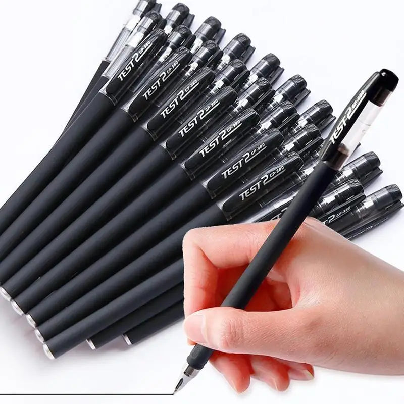 A hand holds a bulk pack of black gel ink pens with tips visible, arranged diagonally.