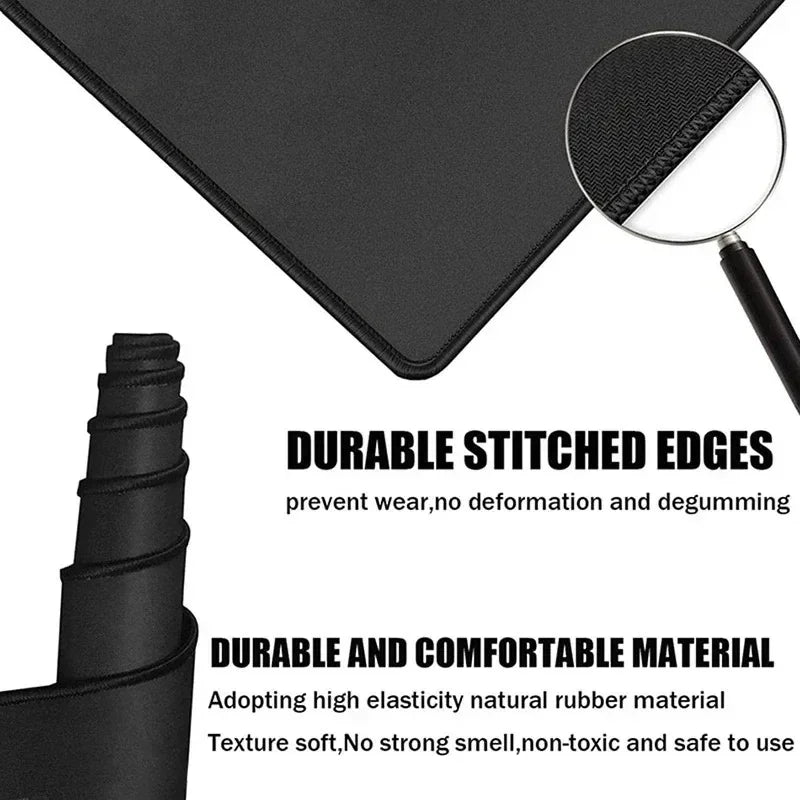 Black gaming mouse pad with stitched edges and a magnifying lens showing durable rubber material