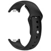 A black silicone replacement strap for a Mi Band watch, shown from the side.