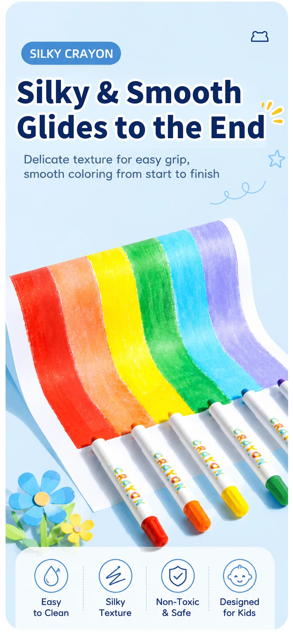 A set of silky crayons in a rainbow gradient color palette shown on white paper.