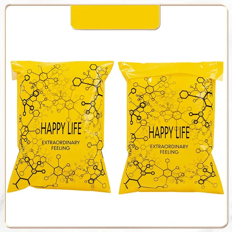 Two yellow reusable plastic mailing bags filled with black spherical objects, labeled Happy Life Extraordinary Feeling.