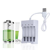 A white battery charger device with multiple cell slots and a cord, shown next to a glass container illustrating charge level