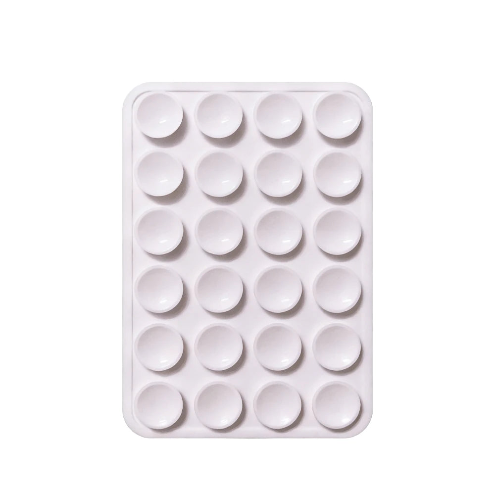 Soporte para teléfono de ventosa de silicona blanca con agujeros circulares múltiples para montar dispositivos.