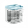 A white acrylic desktop pen holder with a light blue lid and two clear compartments.