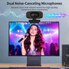 A dual noise-canceling microphone camera is positioned above a monitor displaying a woman singing into a microphone.