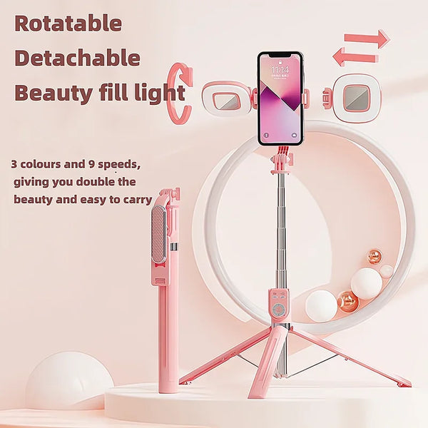 A pink rotatable detachable beauty fill light and selfie stick displayed on a white surface.