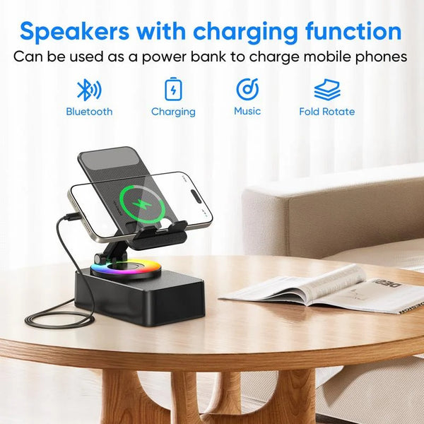A black wireless speaker with a phone stand and charging function is placed on a wooden table.