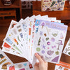 A collection of aesthetic scrapbooking stickers featuring nature and animal patterns on a sheet of paper.