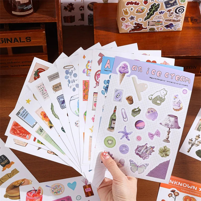 A collection of aesthetic scrapbooking stickers featuring nature and animal patterns on a sheet of paper.