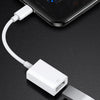 A white universal adapter cable connecting a Lightning port to a Micro USB port for data transfer.