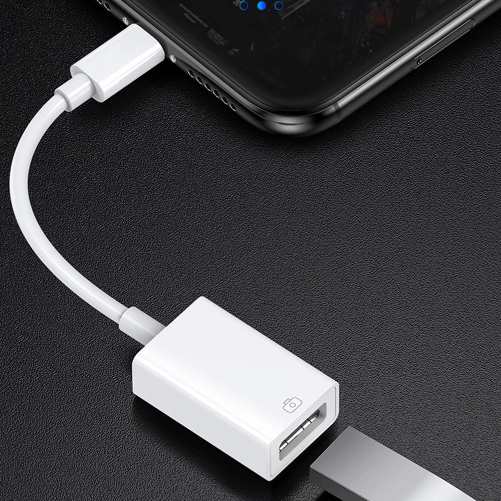 A white universal adapter cable connecting a Lightning port to a Micro USB port for data transfer.
