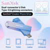 Un disco U SanDisk Dual-connector azul junto a varios dispositivos electrónicos como un teléfono, tableta, portátil y computa