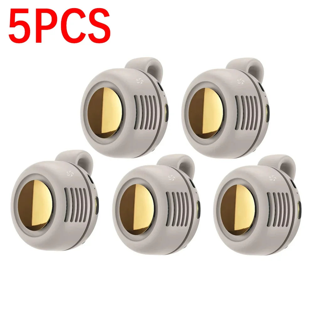 Five portable mini blade-less electric fans in a light gray color shown from above