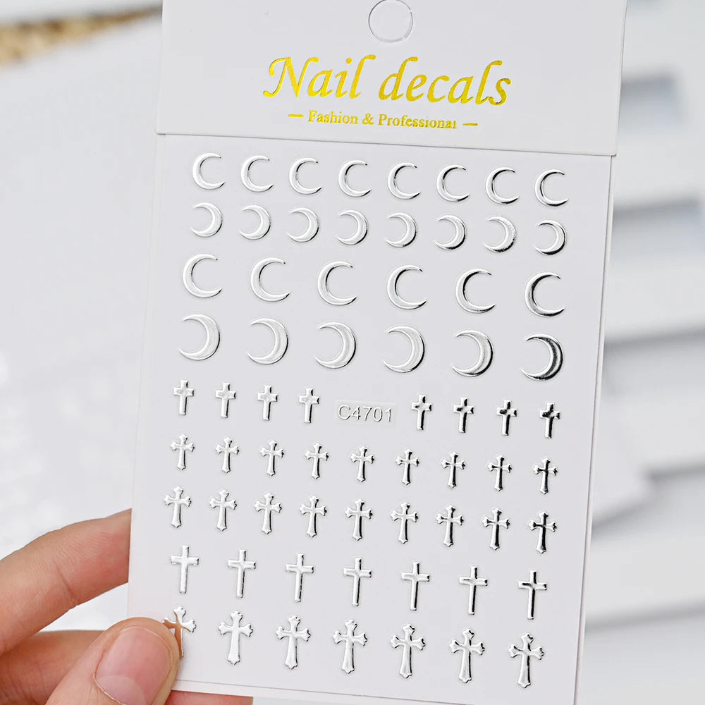 A white packaging box for a set of metallic 3D star nail art stickers featuring various designs.