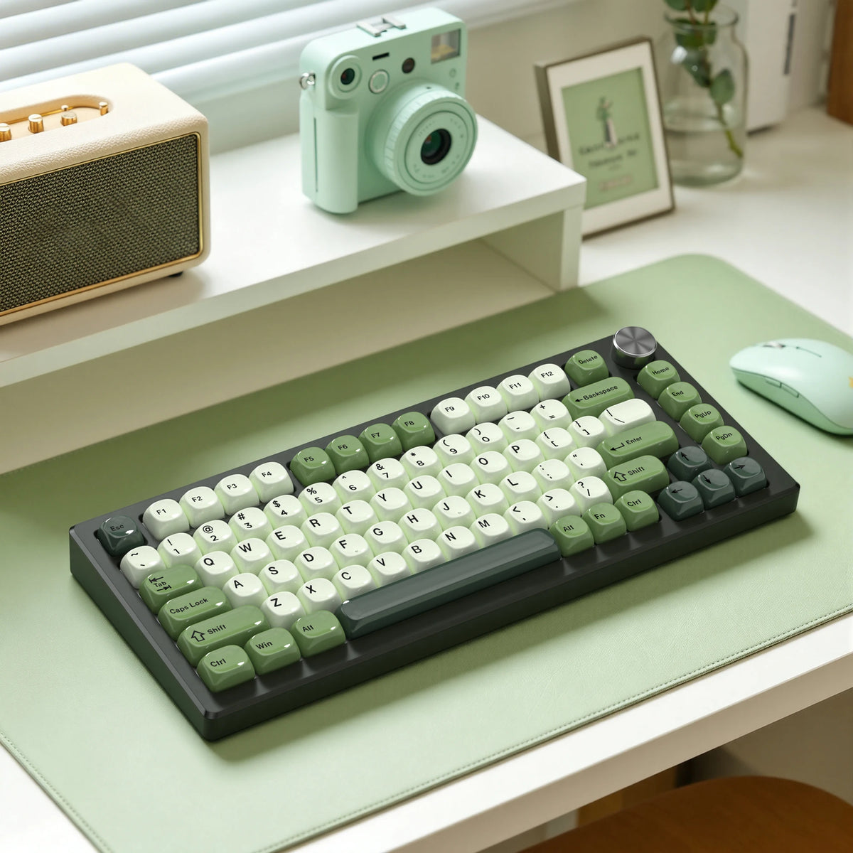 A close-up view of a dark green MOA Profile PBT keycaps set for mechanical keyboards resting on a light green surface.