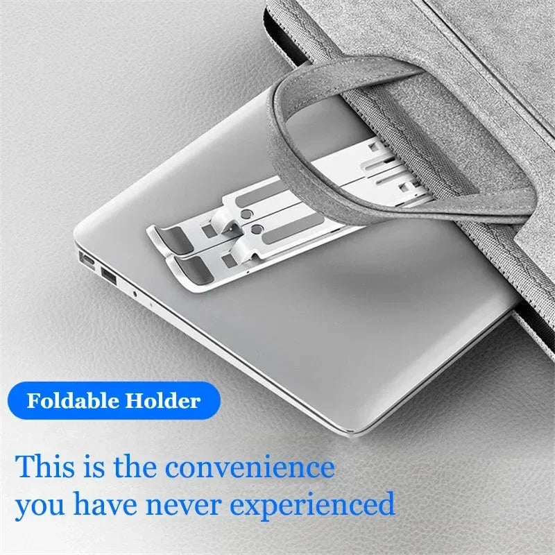 A silver laptop is shown resting in a gray foldable holder designed to adjust the laptop's height.
