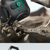A black magnetic AirPods case with a green light is shown resting on a rocky surface.