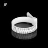 A white precision ring sizer and gauge tool with a numbered scale is shown against a black background.