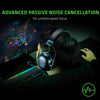 A person wearing a black gaming headset is focused on a computer screen, utilizing advanced passive noise cancellation.