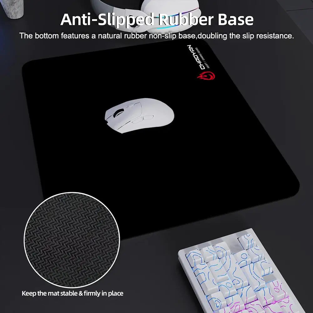 A black gaming mouse pad with a natural rubber non-slip base and a silicone wrist rest.