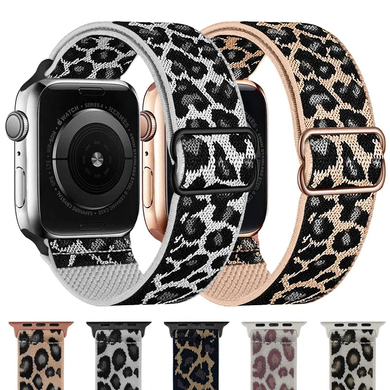 A close-up view of a black Apple Watch with a leopard print nylon band and a rose gold watch face.
