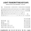 Light-transmitting keycaps for a mechanical keyboard featuring various function and alphanumeric keys.