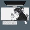 A large white gaming mousepad featuring an illustration of a man with long hair and beard in a dramatic pose.