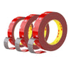 Rolls of red heavy duty acrylic foam double sided tape with yellow markings and gray backing.