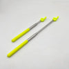 A telescopic stainless steel teaching pointer with a yellow handle and green tip.