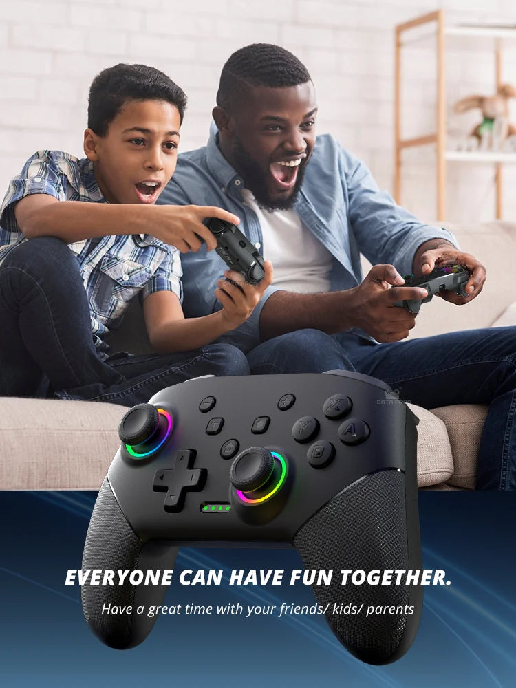 A black programmable controller is shown in use by a man and a boy playing together.