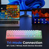 A mechanical keyboard with RGB lighting is shown alongside a laptop and tablet, demonstrating Tri-Mode Connection features.