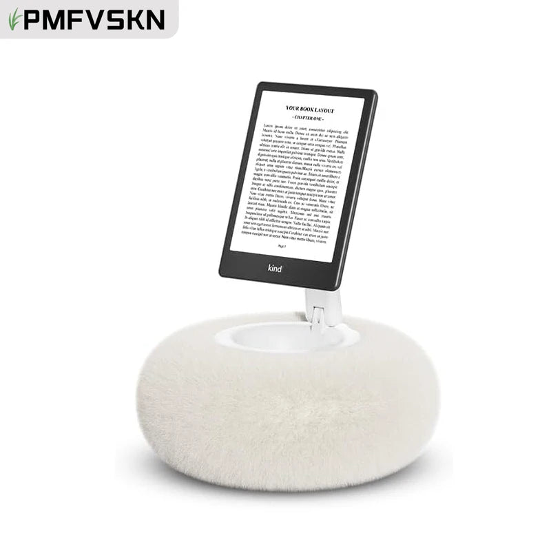 A white magnetic pillow stand holding a tablet device.