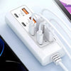 A white 8-in-1 USB wall outlet adapter with multiple ports and cables is shown next to a laptop.