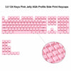 A close-up view of pink jelly ASA profile keycaps for a mechanical keyboard, showing various letter and symbol keys.