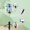 A silver extendable Bluetooth selfie stick with a fill light mounted on a tripod, shown next to various usage examples.