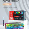 A box of 240 color direct liquid type acrylic markers and a large set of assorted colored markers are displayed on a white su