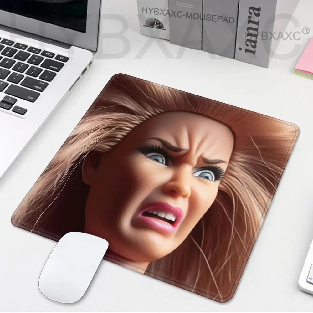 A realistic doll face design mouse pad featuring a brown hairstyle and intense expression.