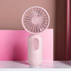Pinkes, tragbares USB-Ladedes Mini-Handventilator mit kreisförmigem Gitter auf weißem Untergrund.