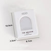 A white plastic collector case for a photo card binder titled The Archive.