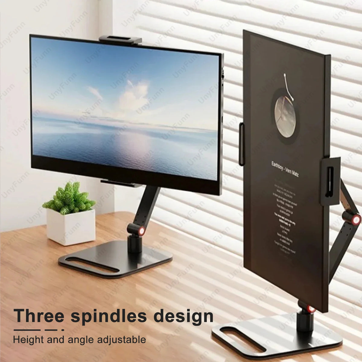 A black monitor is mounted on a three spindles design adjustable stand next to a vertical monitor.