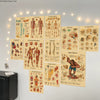 A display of vintage anatomy and physiology posters on a wall, illuminated by string lights.