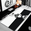 Extra large gaming mouse pad featuring a stylized anime character design on a black and white background.